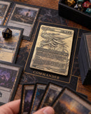 Illustrative tabletop scene featuring engraved metal Ur-Dragon card