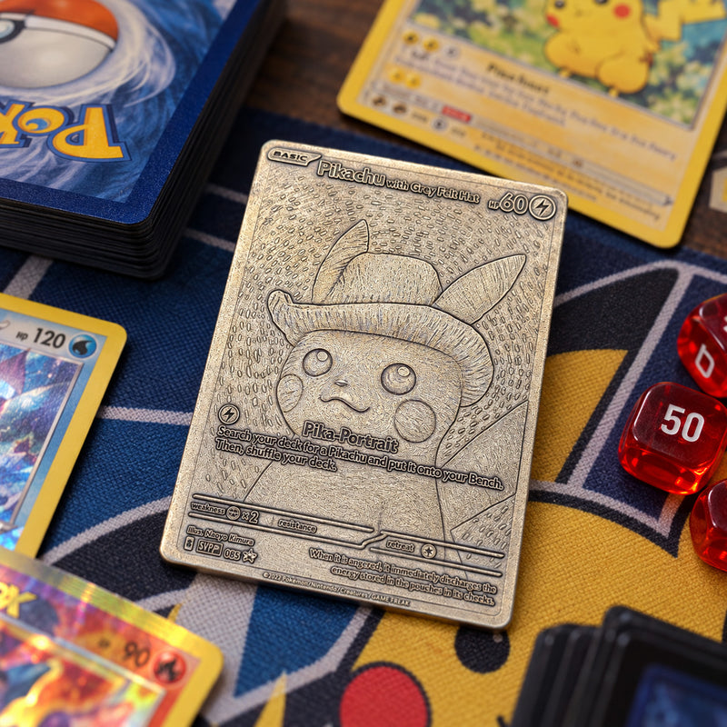 Illustrative Pokemon TCG tabletop scene featuring engraved metal Pikachu card