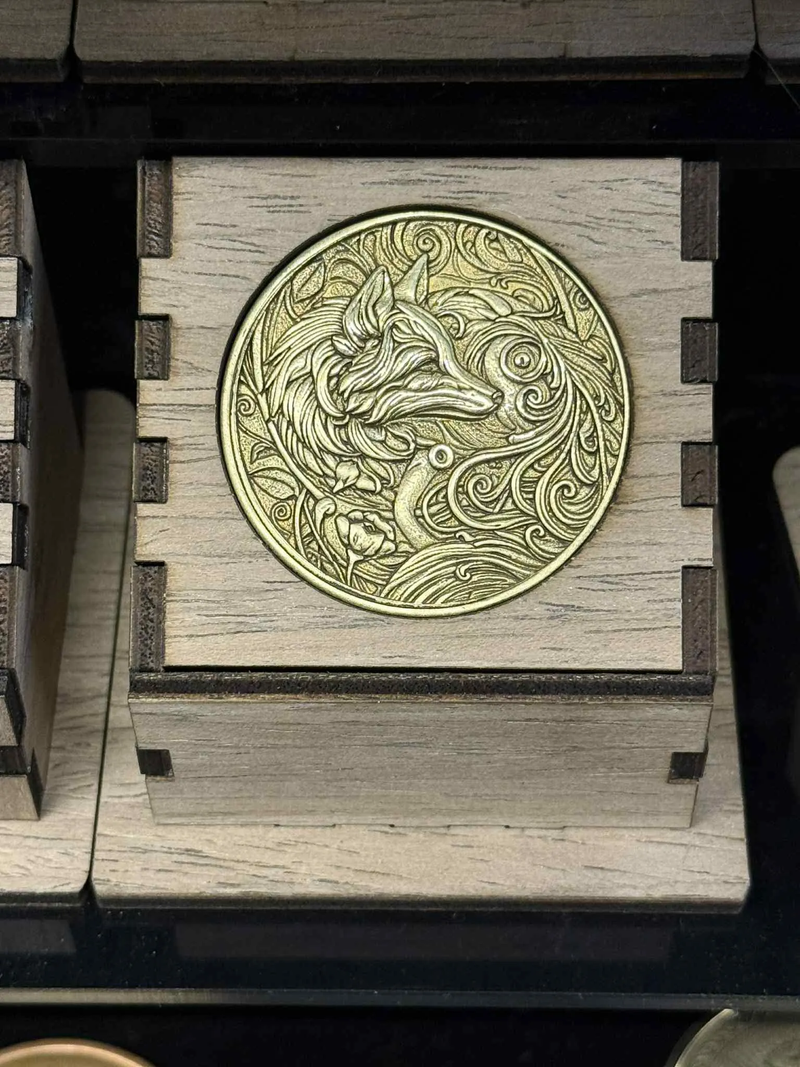 High-detail custom laser engraved metal coin artwork example